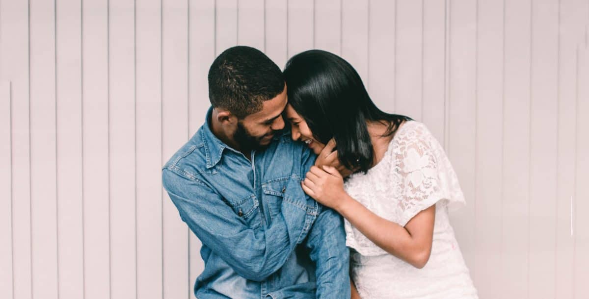 man and woman hugging