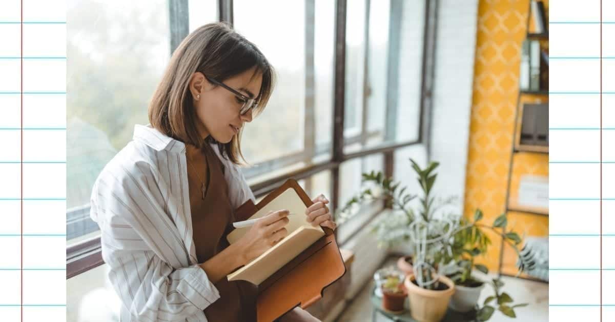 woman writing in a journal