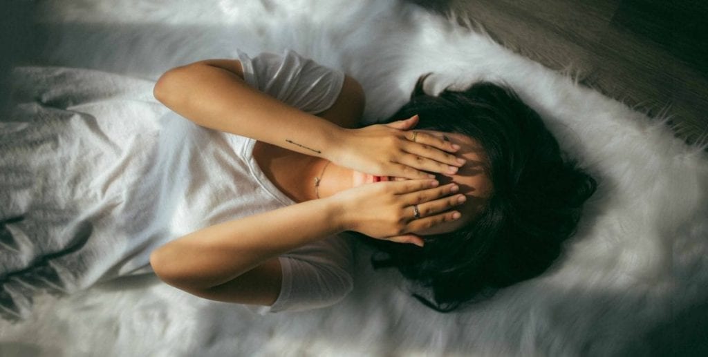 woman played on fur covering her eyes