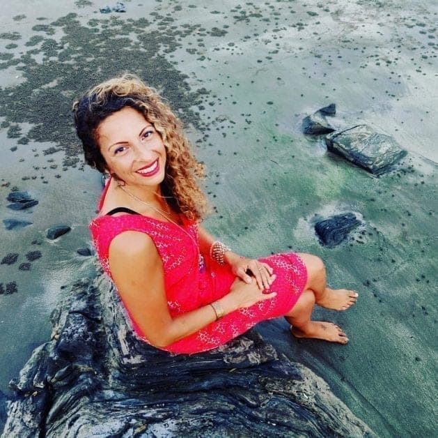 woman sitting by the water