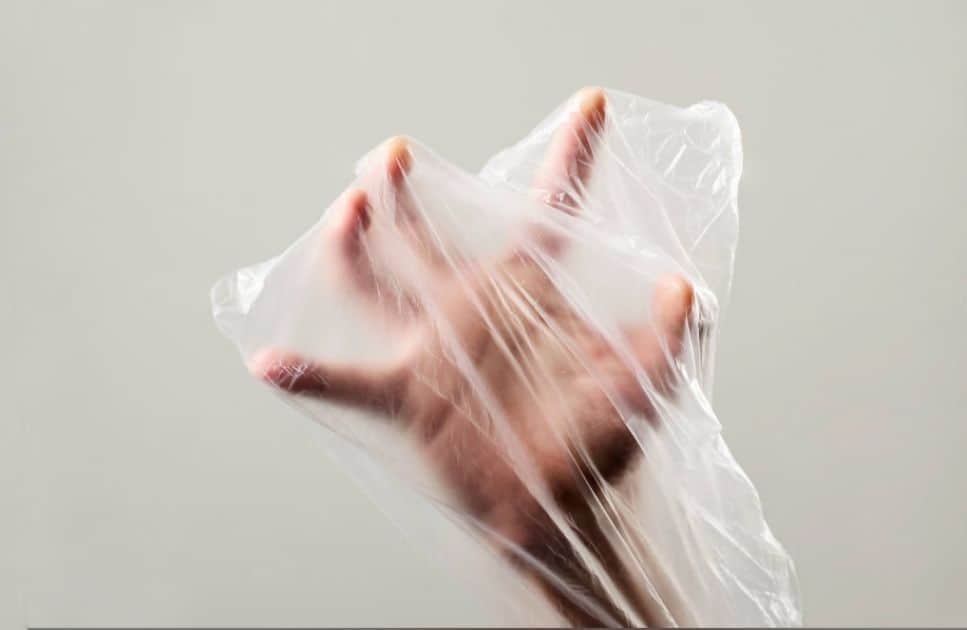 hand in plastic bag