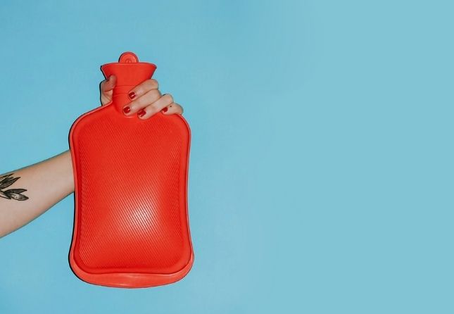 red water bottle on blue background