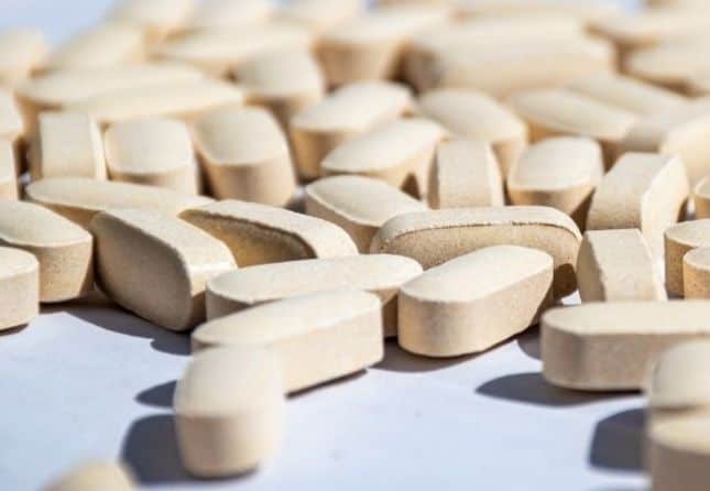 beige pills on blue backgrounds