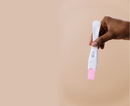 women holding pregnancy test