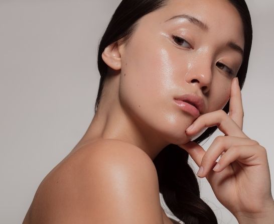 woman posing with glowing skin
