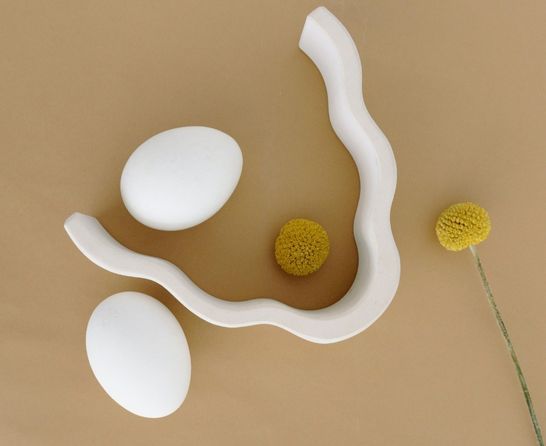 eggs and flower on beige background