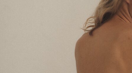 back of a woman with blond hair