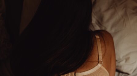women on bed with bra